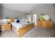 Spacious primary bedroom featuring ample natural light, neutral tones, and stylish furniture at 15157 E Nassau Ave, Aurora, CO 80014