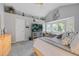 Bright primary bedroom with vaulted ceilings, large windows, and stylish decor at 15157 E Nassau Ave, Aurora, CO 80014