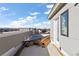 Rooftop image shows construction materials and a neighborhood and distant mountain view at 8 Oneida Ct, Denver, CO 80230