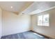 Finished basement with carpet, neutral walls and window at 1488 S Biscay Ct, Aurora, CO 80017
