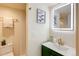 Stylish bathroom with modern vanity, illuminated mirror, and elegant fixtures at 1488 S Biscay Ct, Aurora, CO 80017