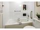 Clean bathroom with updated fixtures, white tiling, and soaking tub at 1488 S Biscay Ct, Aurora, CO 80017