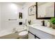 Bright bathroom with updated fixtures, white tiling, and soaking tub at 1488 S Biscay Ct, Aurora, CO 80017