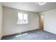 Bedroom with neutral walls, plush carpet and window view at 1488 S Biscay Ct, Aurora, CO 80017