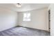 Bedroom featuring plush carpet, neutral walls and window view at 1488 S Biscay Ct, Aurora, CO 80017