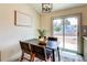 Eat in Dining space with wood table, four chairs and sliding door to outside at 1488 S Biscay Ct, Aurora, CO 80017