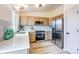 Contemporary kitchen equipped with stainless steel appliances and updated cabinets at 1488 S Biscay Ct, Aurora, CO 80017