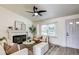 Bright living room features a cozy fireplace and natural light at 1488 S Biscay Ct, Aurora, CO 80017