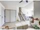 Inviting living room with wood floors, white walls, staircase and view to dining area at 1488 S Biscay Ct, Aurora, CO 80017
