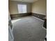 Well-lit bedroom with neutral color palette and carpeted flooring, creating a cozy atmosphere at 8520 S Holland Ln # 302, Littleton, CO 80128