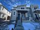 Modern two-story home with gray siding and stone accents, steps leading to the front entrance at 22841 E Stanford Ln # B, Aurora, CO 80015