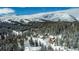 Aerial view of homes nestled in a snowy mountainside at 229 Lee Ln, Breckenridge, CO 80424