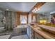 Elegant bathroom with a soaking tub, walk-in shower, and a unique stone countertop at 229 Lee Ln, Breckenridge, CO 80424