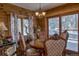 Charming dining area with a wood table and mountain views at 229 Lee Ln, Breckenridge, CO 80424