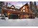 Stunning log home exterior with a spacious deck and mountain views at 229 Lee Ln, Breckenridge, CO 80424