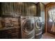 Laundry room with granite countertop and modern appliances at 229 Lee Ln, Breckenridge, CO 80424