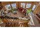 High-angle view of a living room with a wooden staircase and large windows at 229 Lee Ln, Breckenridge, CO 80424