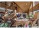 Spacious living room featuring a stone fireplace and a loft area at 229 Lee Ln, Breckenridge, CO 80424