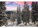 Snowy mountain vista viewed from a home's window at 229 Lee Ln, Breckenridge, CO 80424