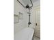 Modern bathroom with a soaking tub, rain shower head and decorative tiled inset at 608 S Grant St, Denver, CO 80209