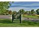 A sign at Washington Park welcomes visitors in front of a meticulously landscaped green space at 608 S Grant St, Denver, CO 80209