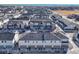 Aerial view of townhouses, showcasing garages and landscaping at 16023 E Warner Pl, Denver, CO 80239