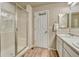 Bathroom featuring a shower and tub combo and updated vanity at 16023 E Warner Pl, Denver, CO 80239