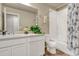 Neat bathroom with a bathtub, shower, and updated vanity at 16023 E Warner Pl, Denver, CO 80239