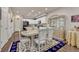 Dining area with table and chairs, open to the kitchen at 16023 E Warner Pl, Denver, CO 80239