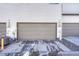 Attached garage with ample space for parking and storage at 16023 E Warner Pl, Denver, CO 80239