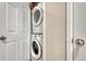 Convenient laundry closet with stackable washer and dryer at 16023 E Warner Pl, Denver, CO 80239