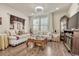 Living room with comfy seating, coffee table, and fireplace at 16023 E Warner Pl, Denver, CO 80239