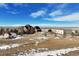 Aerial view of house, barn, and shop on large lot at 556 S Manila Rd, Bennett, CO 80102