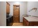 Convenient laundry room with washer, dryer, and built-in cabinets at 556 S Manila Rd, Bennett, CO 80102