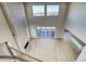 Bright living room with a fireplace, floor-to-ceiling windows and hardwood floors at 8724 Big Thompson St, Littleton, CO 80125