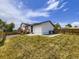 Fenced backyard featuring green grass and a charming deck at 2830 E 99Th Way, Thornton, CO 80229