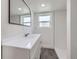 Bathroom featuring updated vanity with mirror and a tiled walk-in shower at 2830 E 99Th Way, Thornton, CO 80229