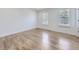 Bright bedroom with wood floors, offering a serene and comfortable space for rest and relaxation at 2830 E 99Th Way, Thornton, CO 80229