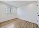 Bright bedroom with wood floors and a window, providing natural light and a comfortable ambiance at 2830 E 99Th Way, Thornton, CO 80229