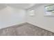 A quaint bedroom with gray carpeted floors and a double pane window at 2830 E 99Th Way, Thornton, CO 80229