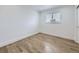 Well-lit bedroom with wood floors, featuring a window with blinds and ample space for personalization at 2830 E 99Th Way, Thornton, CO 80229