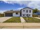 Charming two-story home with a well-maintained front yard, driveway, and inviting curb appeal at 2830 E 99Th Way, Thornton, CO 80229