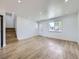 Bright and open living room with hardwood floors and ample natural light at 2830 E 99Th Way, Thornton, CO 80229
