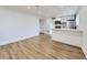 Bright living room with updated kitchen and laminate floors throughout at 2830 E 99Th Way, Thornton, CO 80229