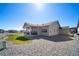 The home's backyard features low maintenance landscaping and a covered patio at 5925 La Posada Pl, Parker, CO 80134