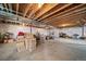 Unfinished basement area ready for customization, featuring exposed beams and ample space at 5925 La Posada Pl, Parker, CO 80134