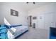 Cozy bedroom with plush carpeting, a daybed, and ample closet space at 5925 La Posada Pl, Parker, CO 80134