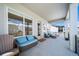 Inviting covered patio with comfortable seating, perfect for relaxing or entertaining guests outdoors at 5925 La Posada Pl, Parker, CO 80134