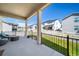View from the covered patio showing a fenced yard and neighboring houses at 5925 La Posada Pl, Parker, CO 80134