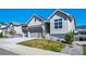 Beautiful home featuring a two-car garage, well-maintained lawn, and picturesque curb appeal at 5925 La Posada Pl, Parker, CO 80134